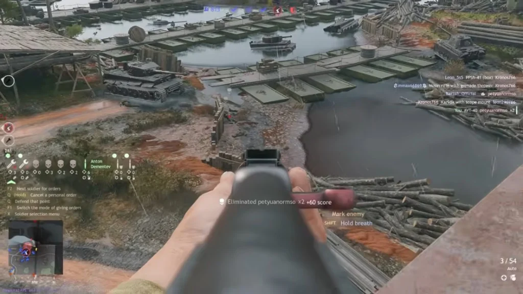 Enlisted health ESP near tanks on a rainy riverbank
